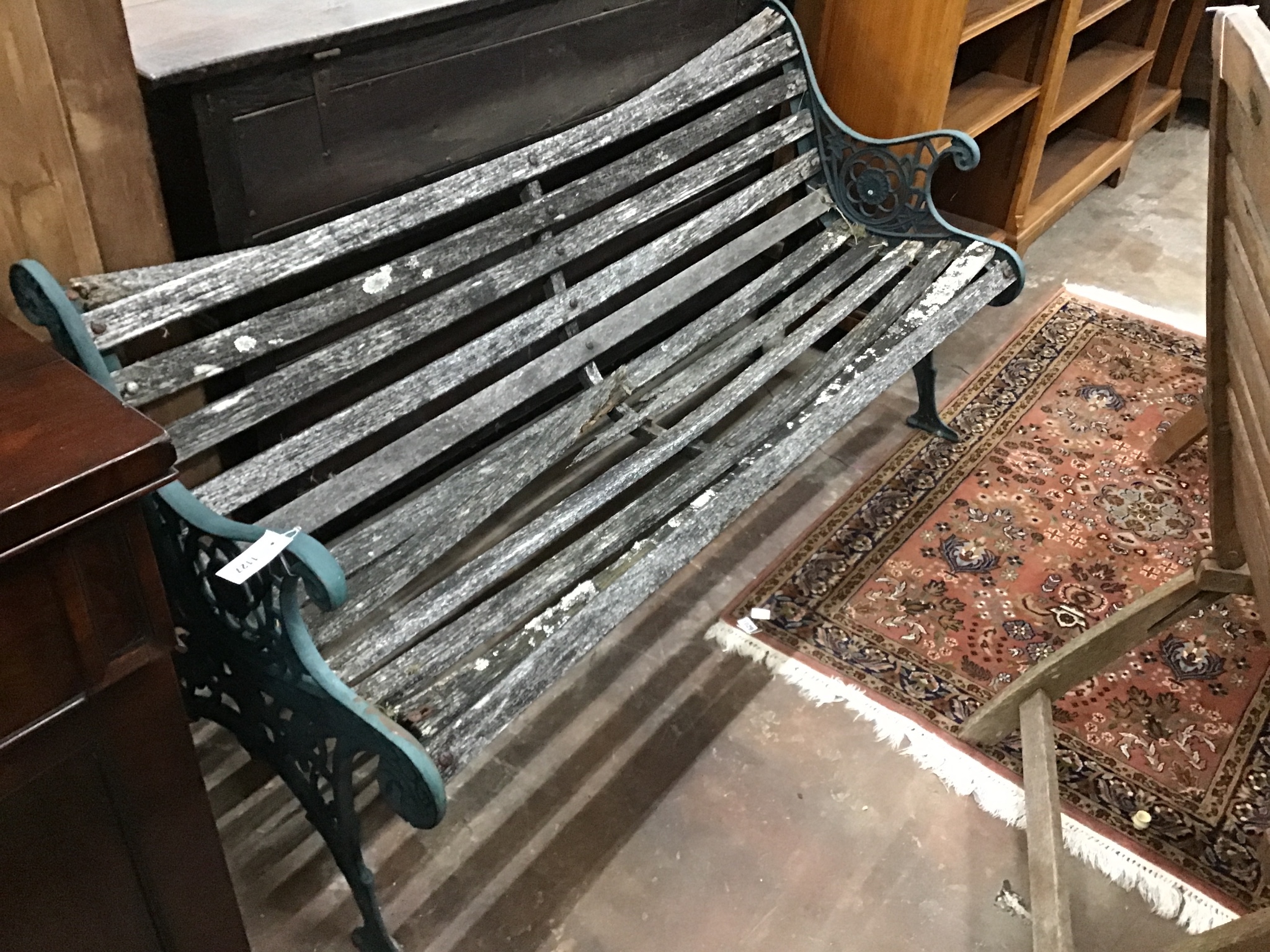 A Victorian style aluminium slatted garden bench in need of repair width 155cm